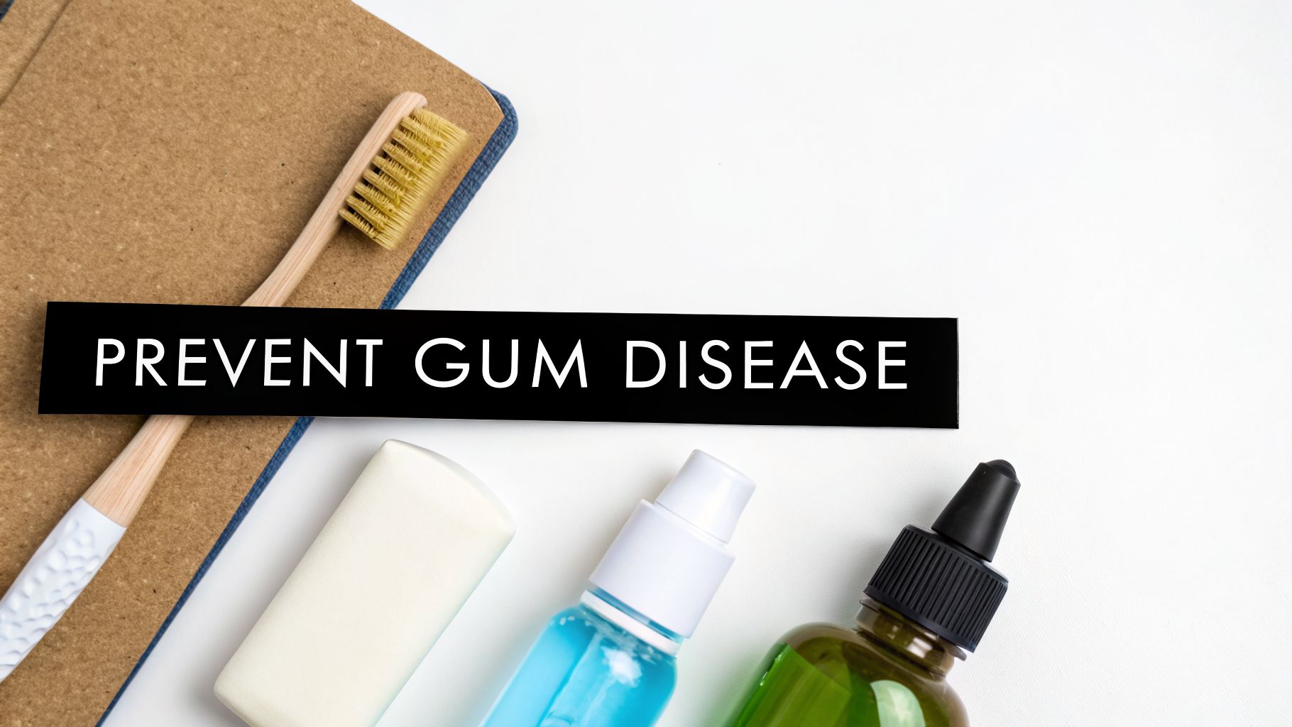 A top-down view of oral hygiene products including toothbrushes, soap, and mouthwash, with a label stating 'PREVENT GUM DISEASE'.