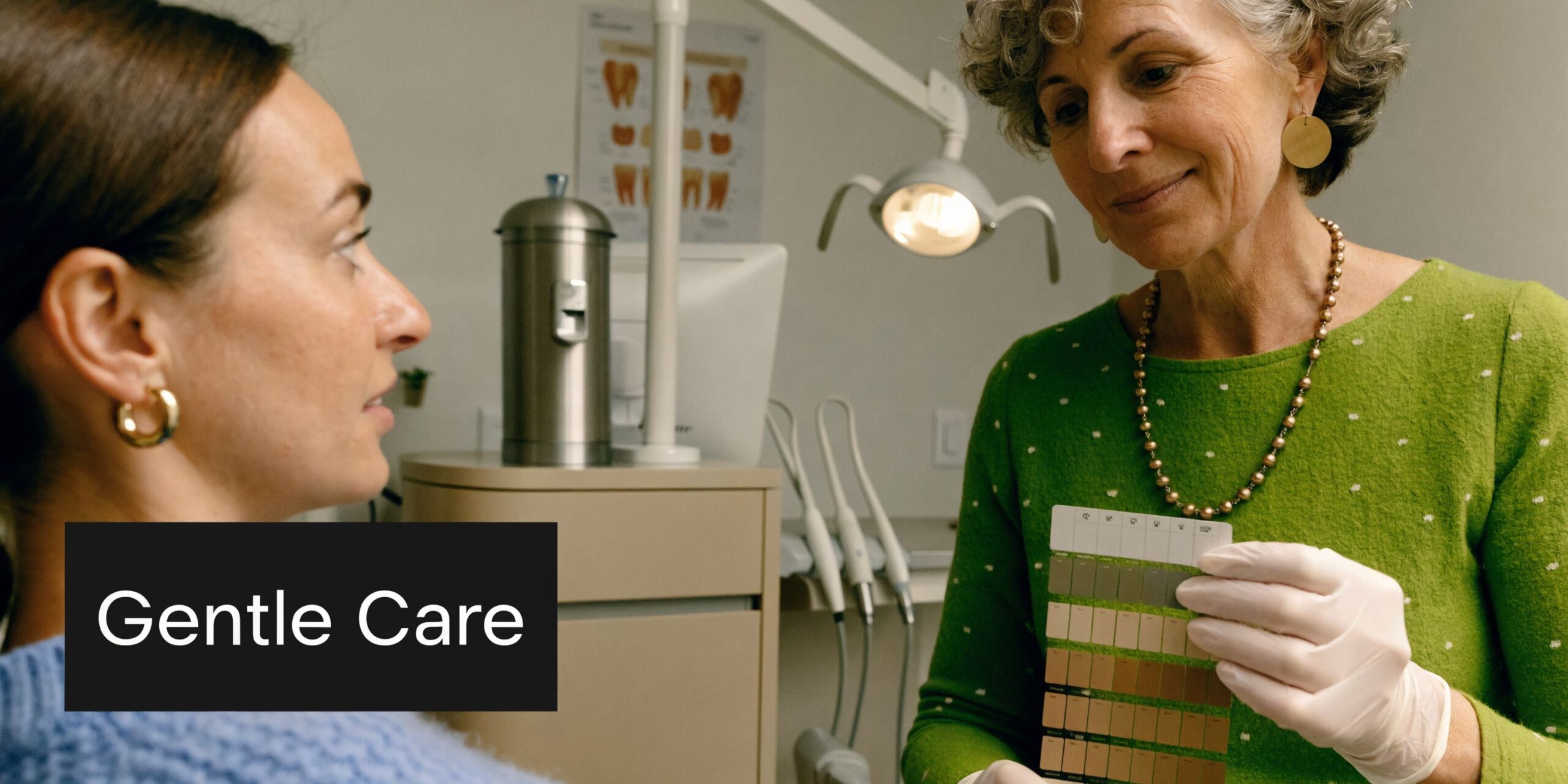 A professional dentist discussing a shade guide with a patient during a gentle dental care consultation.