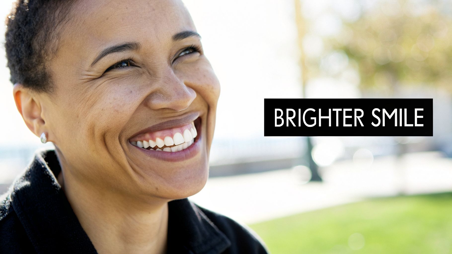 Close-up of a happy woman with a bright, white smile outdoors, demonstrating brighter teeth.