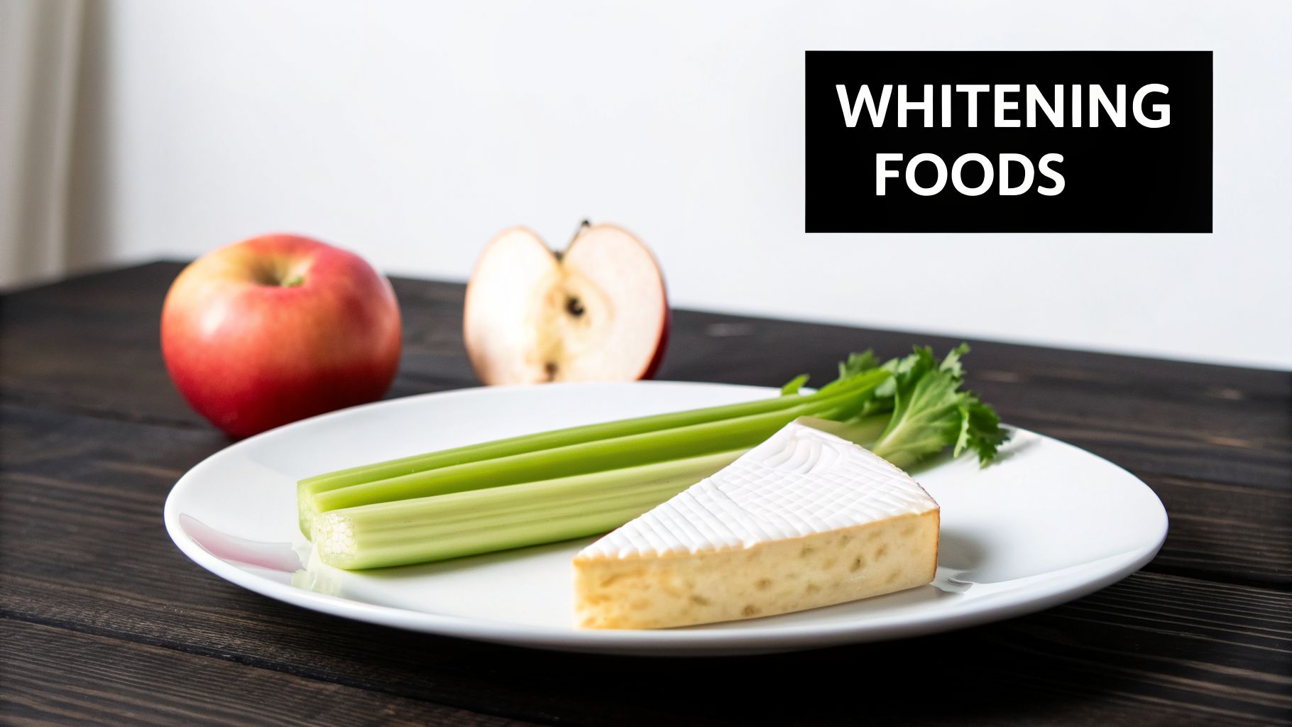 A plate of celery and cheese with two apples in the background, next to a 'WHITENING FOODS' sign.