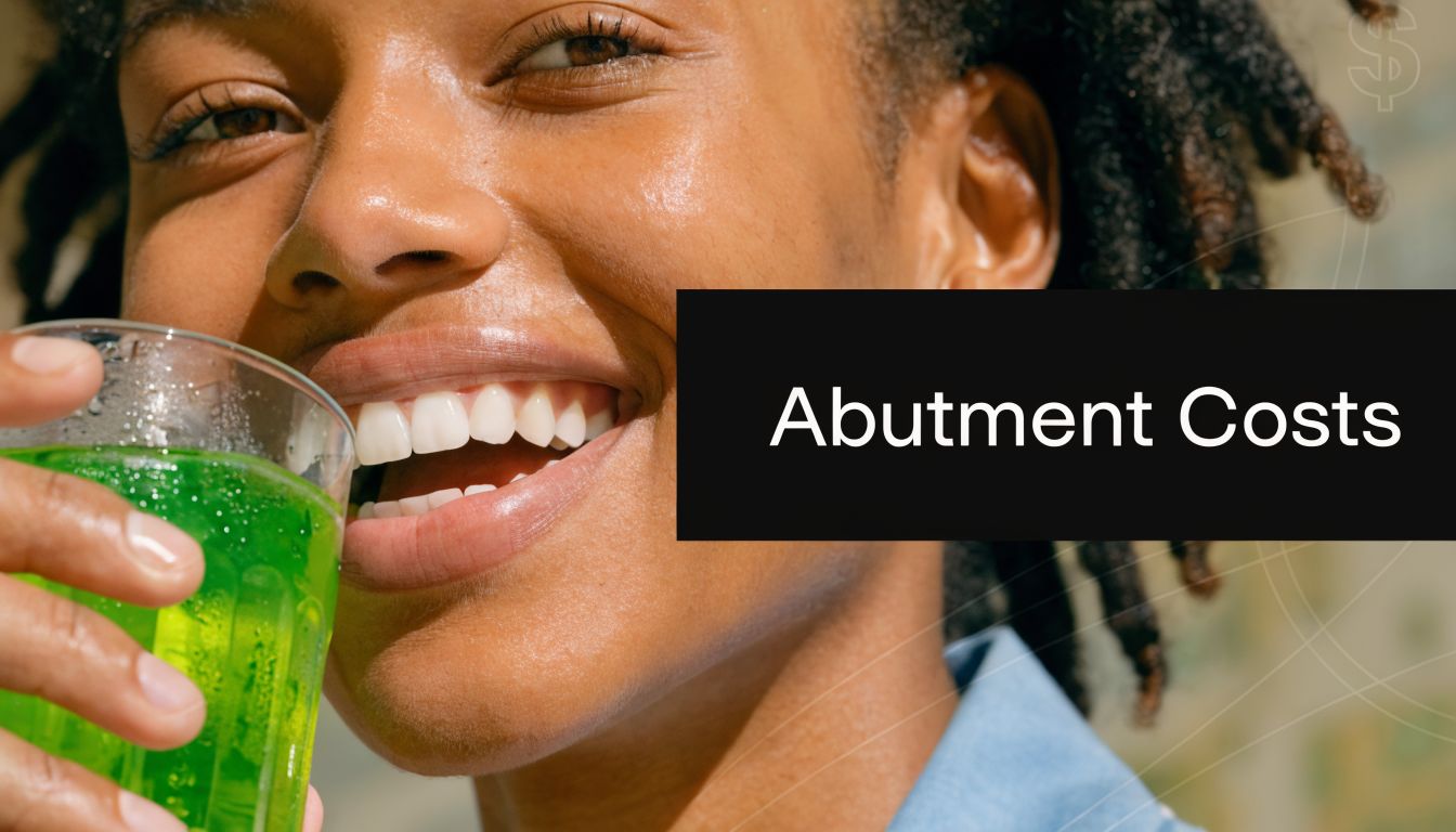 A smiling young woman holding a glass of green juice, focusing on dental implant abutment costs.